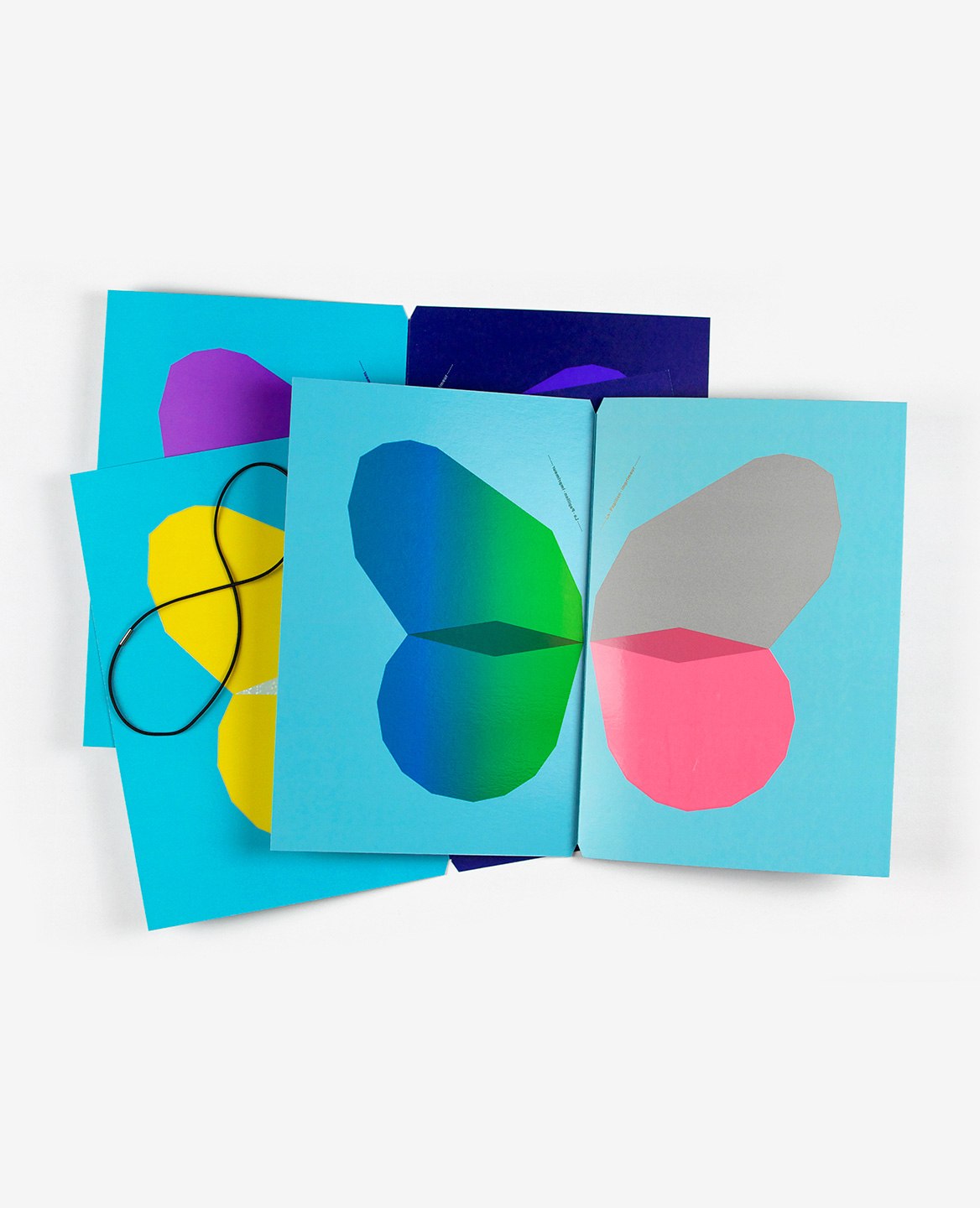 Violet, yellow, blue, green and pink butterflies from the book Le Papillon imprimeur