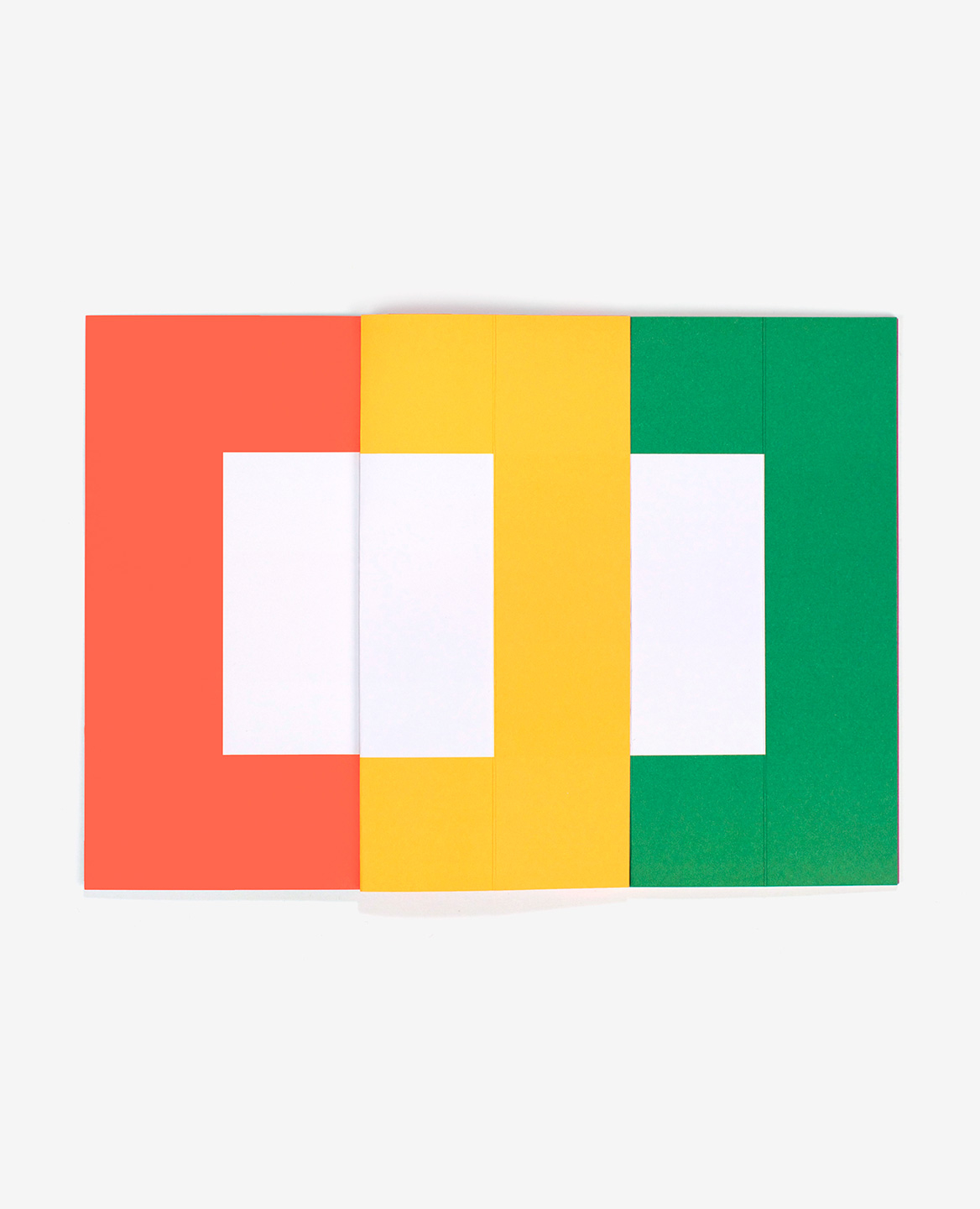 Orange, yellow and green pages from the book Spaces by Antonio Ladrillo