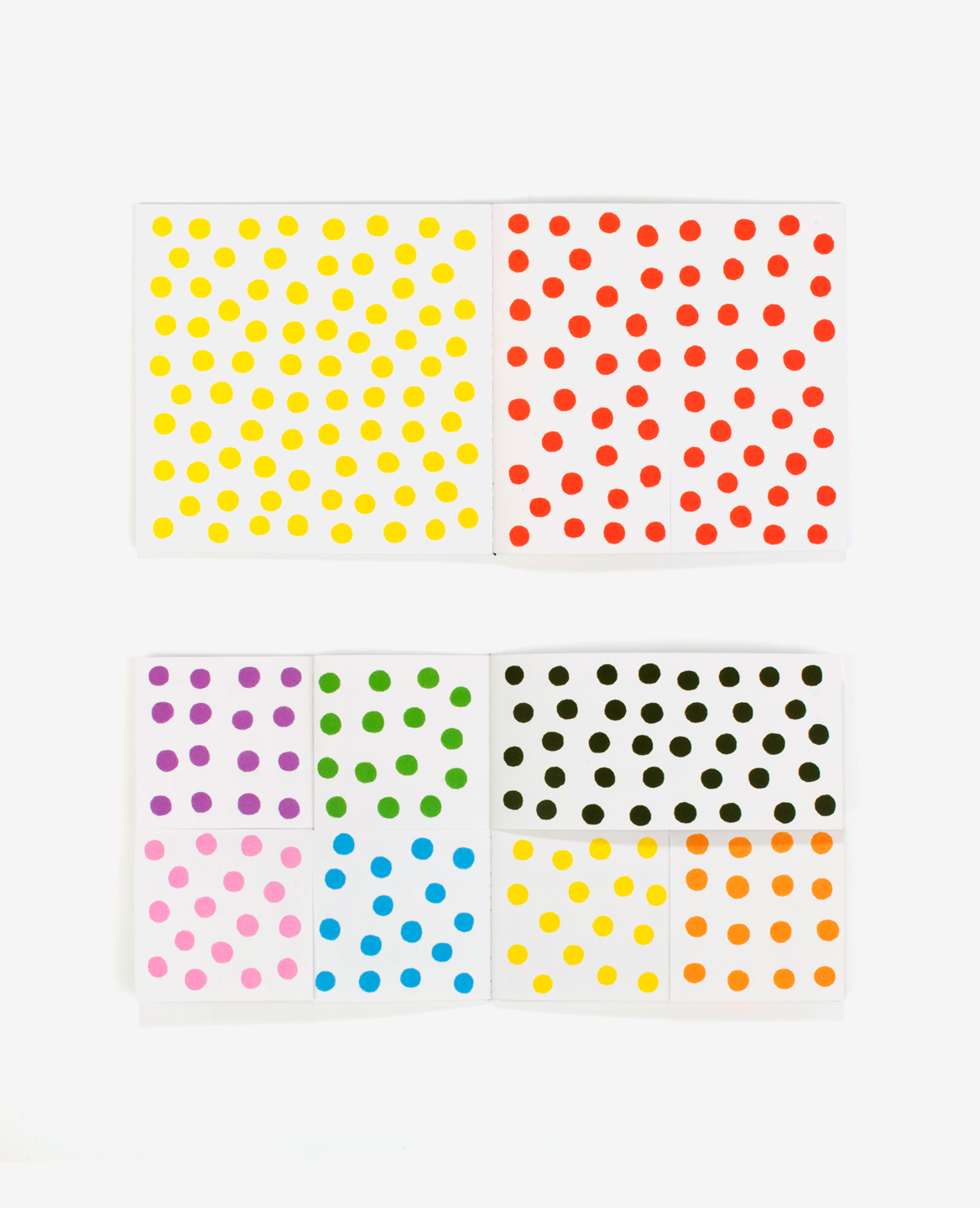 Multi colored pages of the book Dots by Antonio Ladrillo published by Éditions du livre