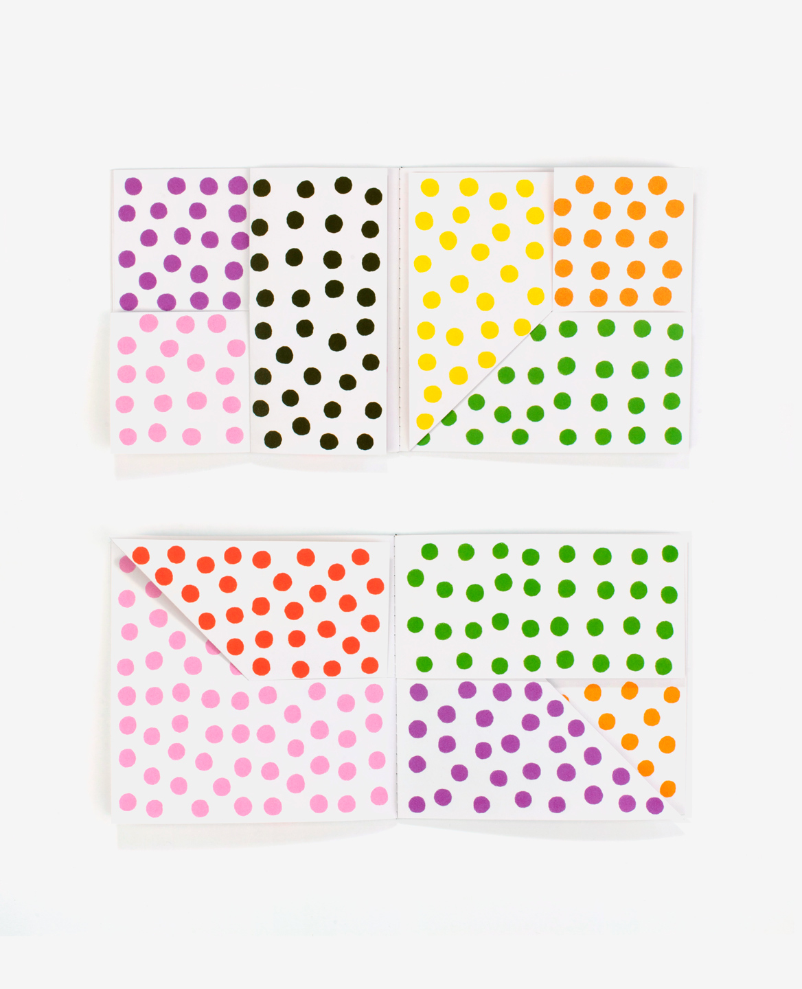 Multi colored pages of the book Dots by Antonio Ladrillo published by Éditions du livre